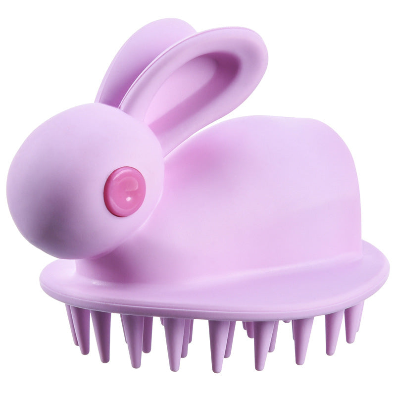 Light purple kids' scalp brush shaped like a cute bunny with a dark pink eye and flexible silicone bristles.