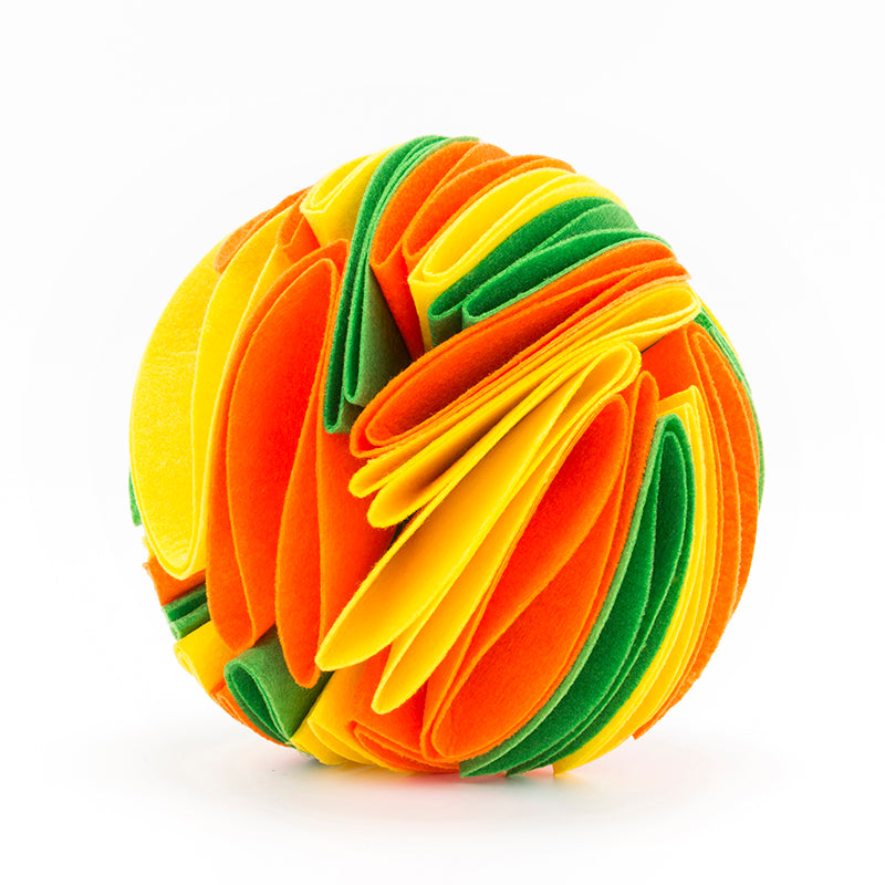 Interactive dog snuffle ball made of layered, felt-like fabric in vibrant green, yellow, and orange on white.
