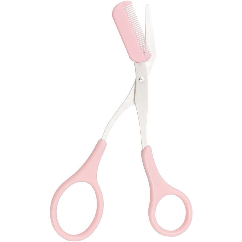 Pink eyebrow grooming scissors with an attached plastic comb on one blade against a white background.