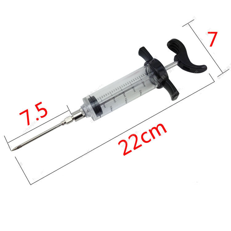 Clear plastic BBQ flavor injector syringe with black handle and metal needle, showing measurements in centimeters.