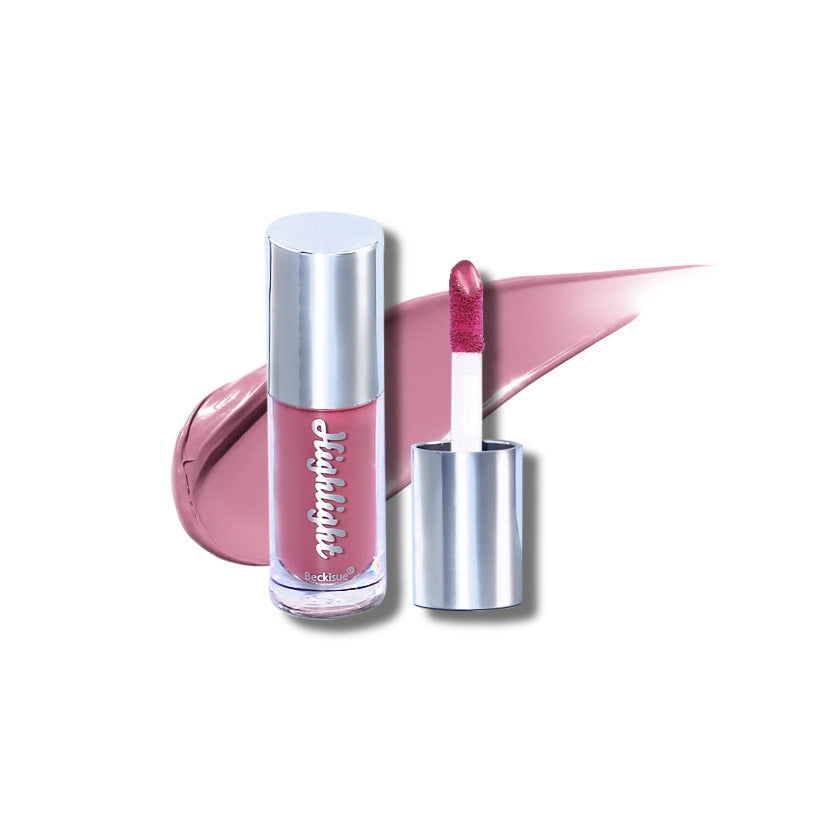 Mauve luminous mirror lip gloss in a clear tube with a silver cap and a matching mauve swatch on a white background.
