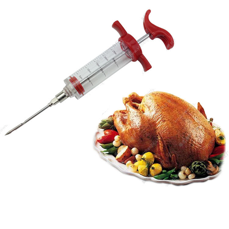 BBQ flavor injector syringe with a clear, marked barrel and red handle, angled above a roasted chicken on a plate.