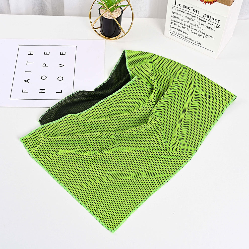 Bright lime green microfiber cooling towel with a dark gray mesh texture, displayed on a white surface.