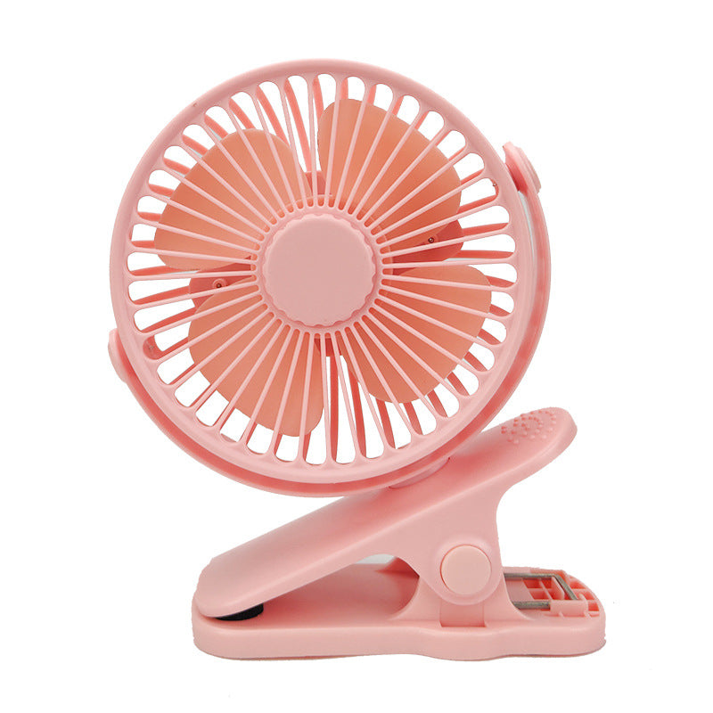 Compact, pastel pink USB-rechargeable clip-on fan with a circular head and five plastic blades against a white background.