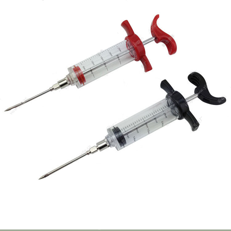 Two BBQ flavor injector syringes with clear 30ml barrels and stainless steel needles, one with red trim, one with black.