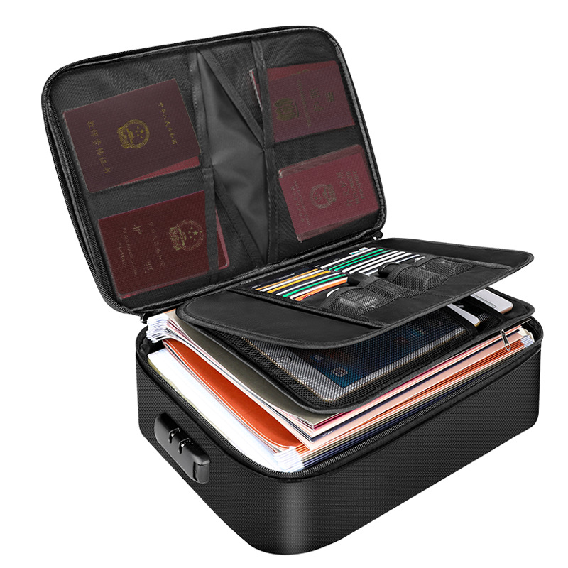 Open black FlameGuard document case with a combination lock, organizing passports, tablets, and stacked paperwork.