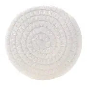 Round white artisan coaster made of coiled, textured woven cotton.