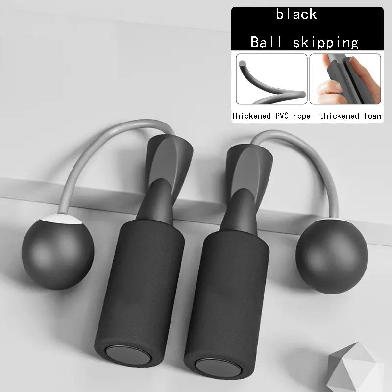 Black cordless jump rope set with thickened foam handles and PVC weighted balls for home fitness training.