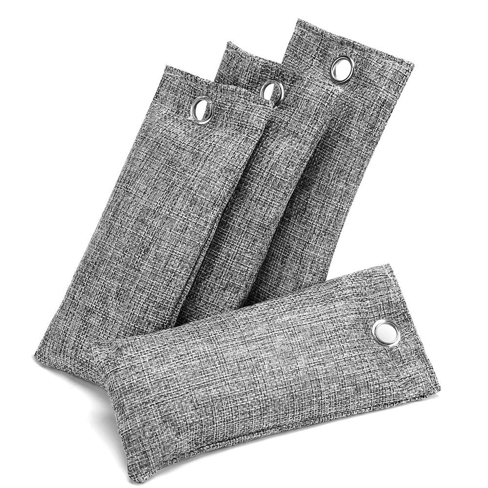 Four rectangular gray linen-textured bamboo charcoal air purifying bags, each with a silver metal hanging grommet.