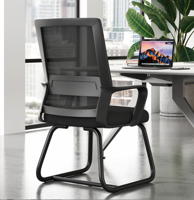 Black AquaFlow mesh office chair with a sleek, minimalist frame and cantilever base in a modern home office.