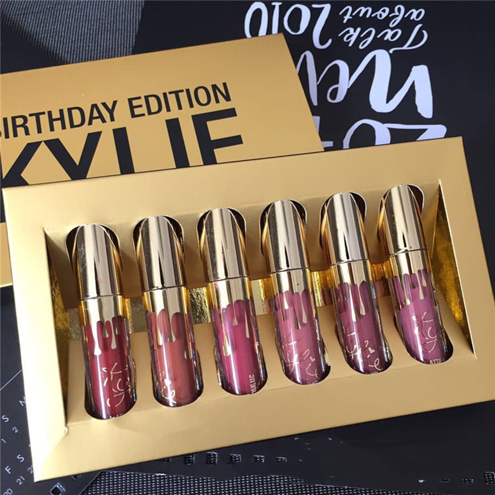 Kylie Birthday Edition 6-piece liquid lipstick set in gold packaging featuring varying shades of pink and mauve.
