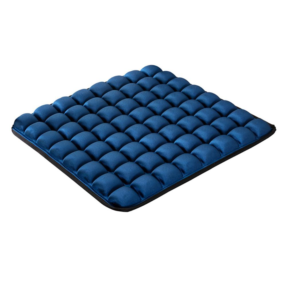 Blue ergonomic seat cushion featuring a grid of plush, bubble-like air cells on a black base.