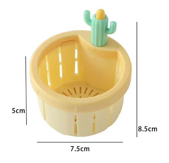 Yellow plastic kitchen sink strainer with a cute mint-green cactus-shaped handle and measurement labels.