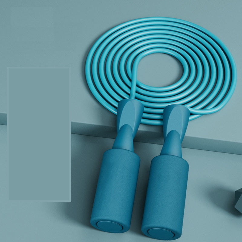 VersaRope dual-mode jump rope in matte teal, featuring textured ergonomic handles and a coiled matching cable.