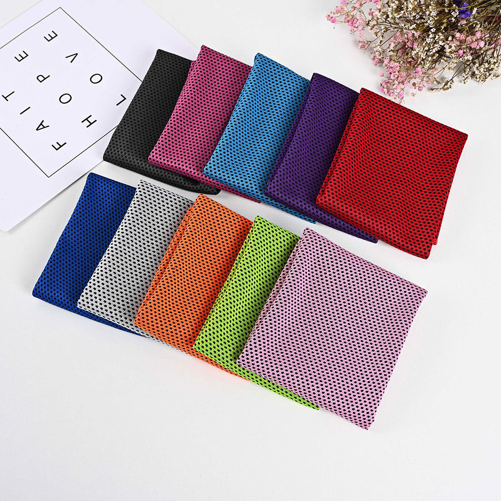 Ten colorful, mesh-textured SwiftCool outdoor activity towels neatly arranged in rows on a white surface.