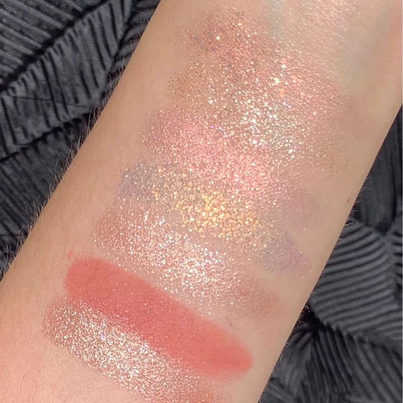 Arm swatches of DIKALU Radiant Sunset eyeshadows showing sunset-toned shimmer, glitter, and matte shades.