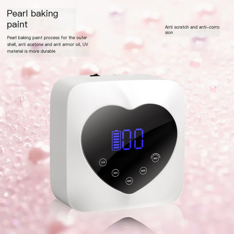 White, heart-shaped X20 cordless UV nail lamp with a digital timer display and touch-sensitive time settings.