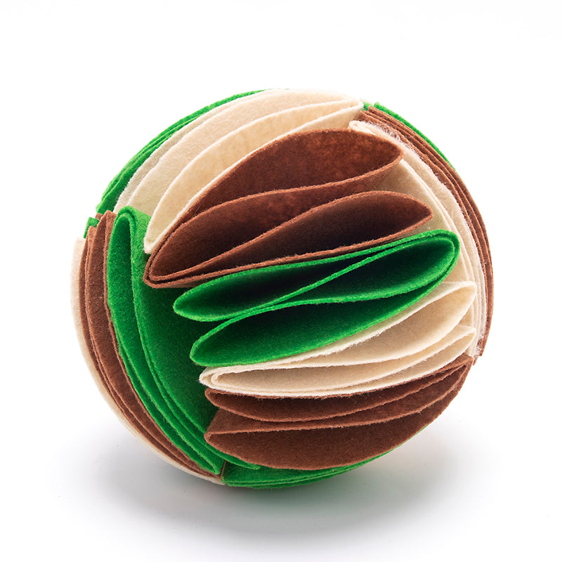 Interactive dog snuffle ball made of layered green, brown, and cream felt fabric for hidden treat foraging.