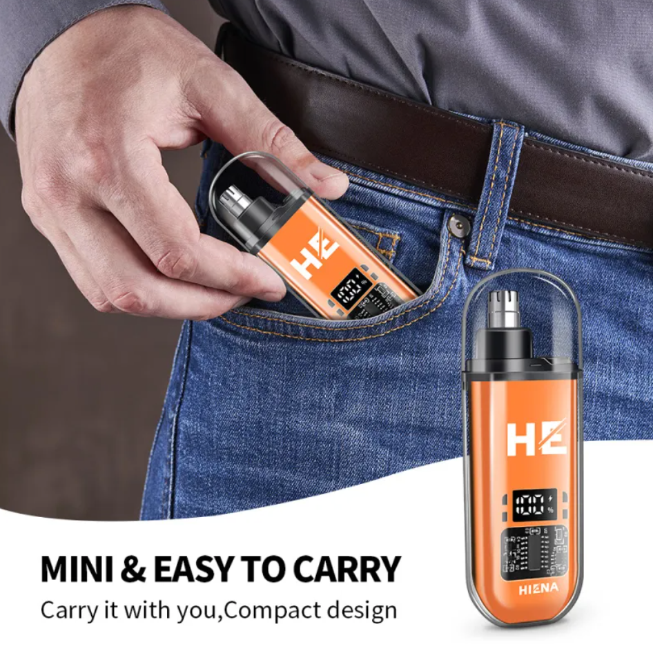 Compact orange electric nose hair trimmer with a clear cap, digital battery display, and portable design in jeans.
