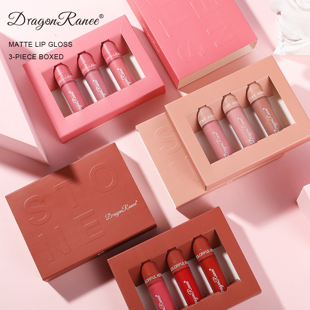 Three Dragon Ranee matte lip gloss sets in pink, nude, and red boxes, each containing three matching lip colors.