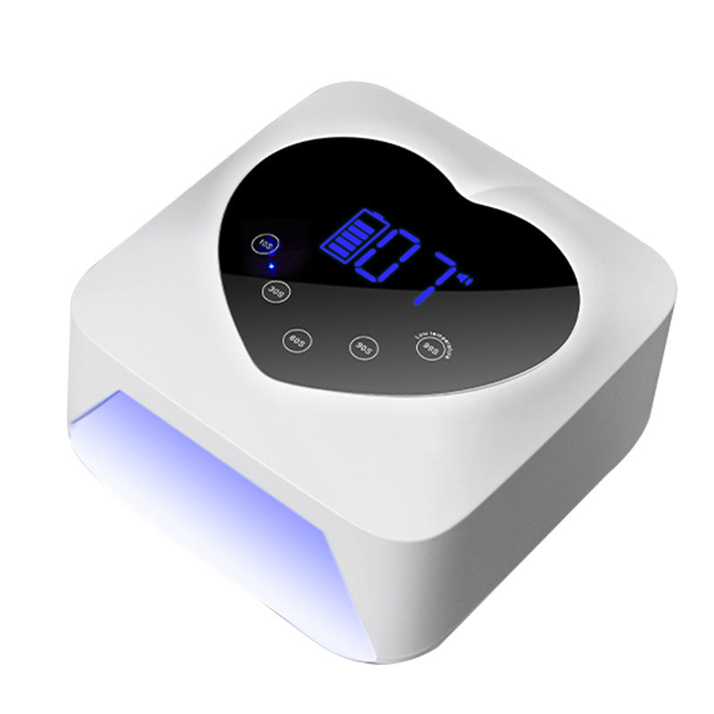 White cordless nail cure lamp with heart-shaped black digital display, timer buttons, and glowing blue interior light.