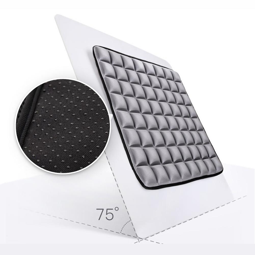 Gray, grid-patterned ergonomic seat cushion with a black non-slip dotted base shown in a close-up detail circle.