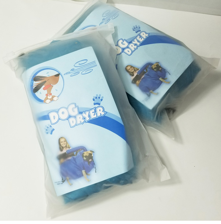 Two blue pet grooming dryer bags in translucent plastic packaging, featuring "Dog Dryer" branding and animal graphics.