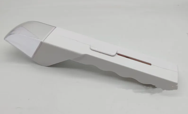 White portable bug grabber tool with a clear plastic catcher hood and an ergonomic, scalloped handle design.