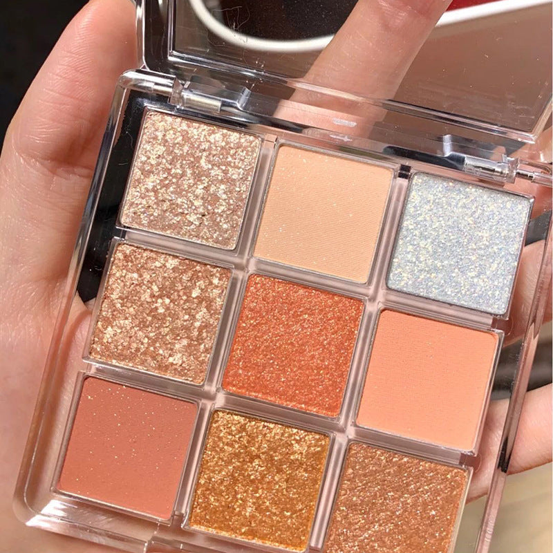 DIKALU 9-color eyeshadow palette featuring sunset-inspired shades in matte, shimmer, and chunky glitter finishes.