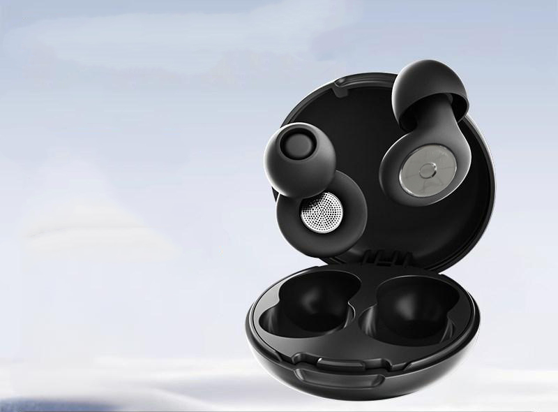 Silent Night earplugs with metallic mesh centers, paired with a matching matte black open storage case.