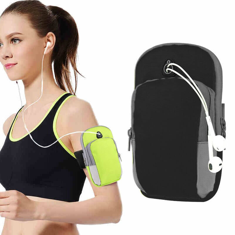 Neon green and grey athletic arm pouch with a headphone port, worn on a runner’s arm with wired earbuds.