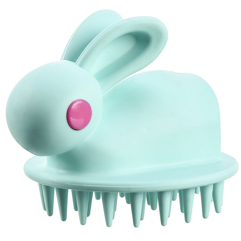 Light blue rabbit-shaped kids' scalp brush with a bright pink eye and soft silicone bristles.