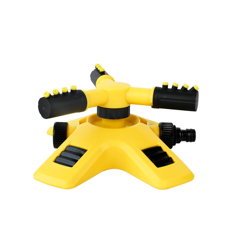 Yellow and black 360-degree rotating lawn sprinkler with three adjustable spray arms on a stable tripod base.