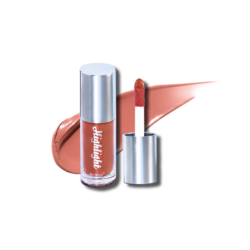 Dusty rose luminous mirror lip gloss in a clear tube with a silver cap and a matching product swatch.