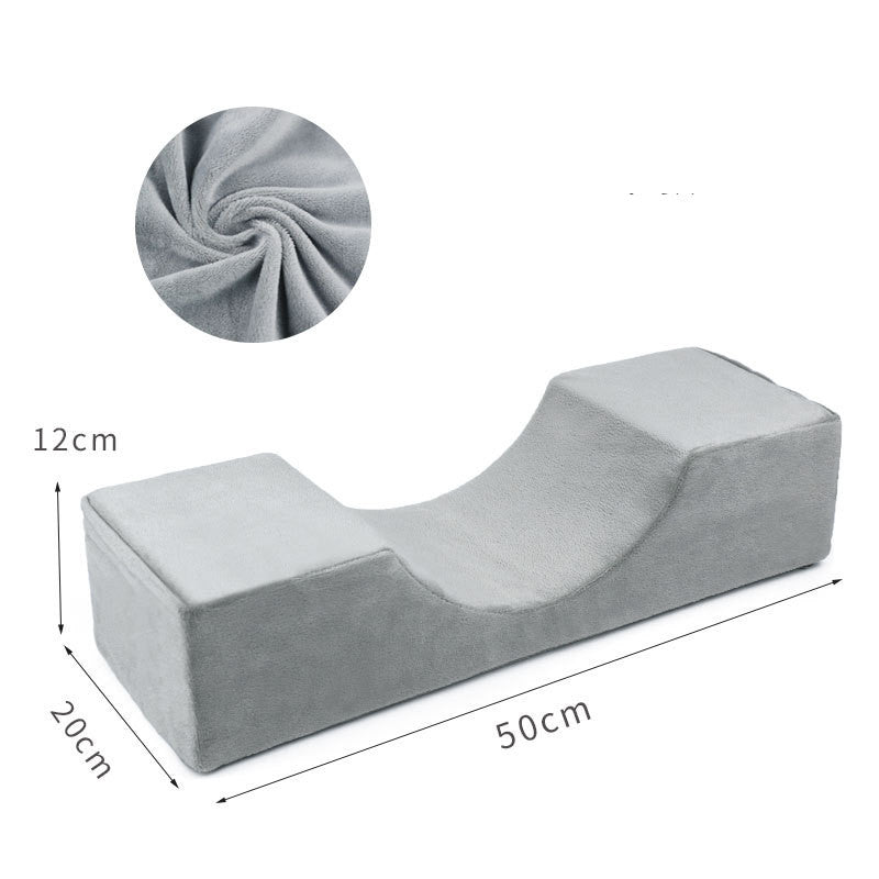 Grey U-shaped memory foam lash pillow with soft plush fabric, measuring 50x20x12cm for ergonomic salon support.