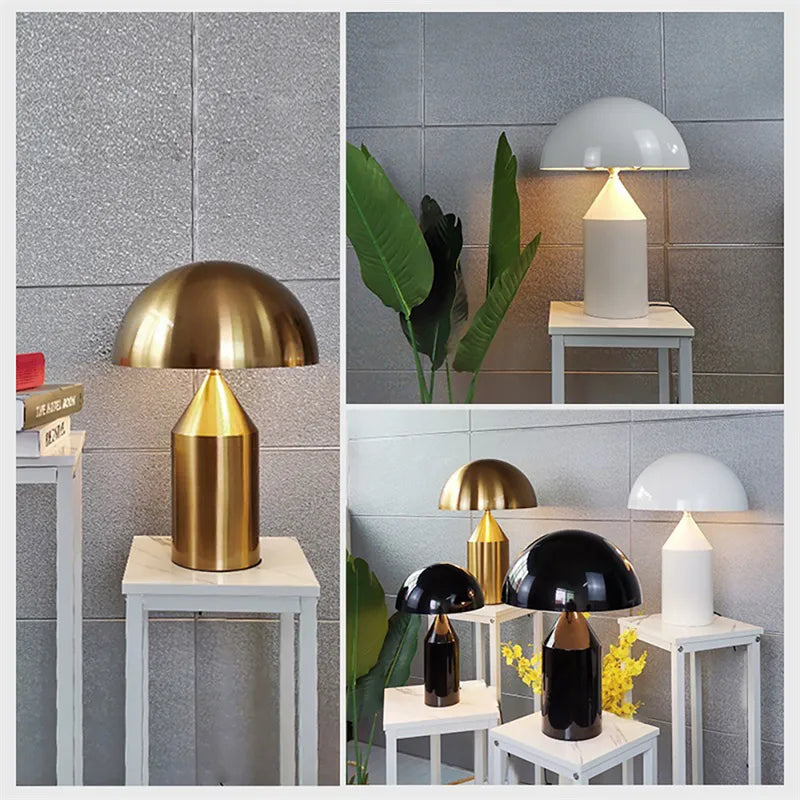 Modern mushroom-style desk lamps with metallic copper, glossy black, and white finishes on white pedestal stands.