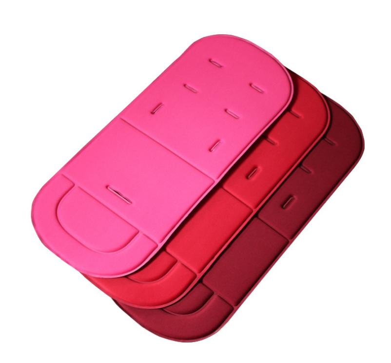 Three universal baby stroller seat pads in gradient shades of pink and red with harness slots, on a white background.