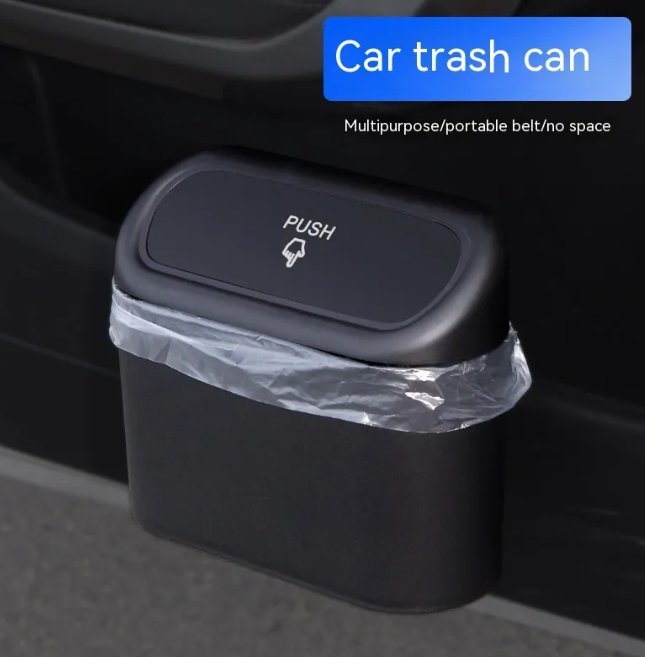 Matte black collapsible car trash bin with a push-to-open lid and a clear plastic bag liner.