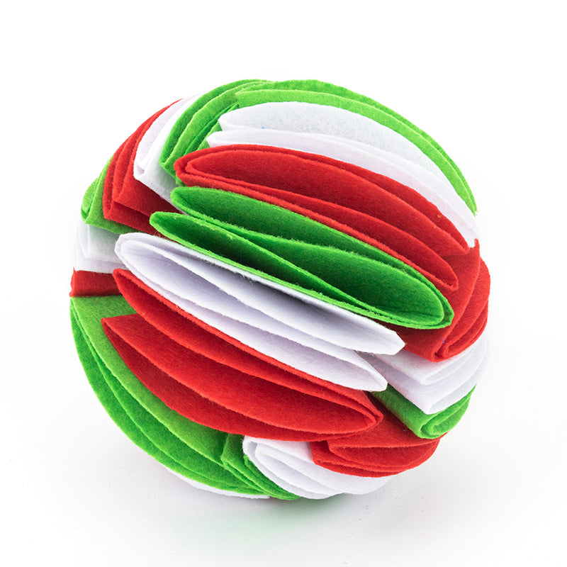 Interactive dog snuffle ball made of layered red, white, and green felt strips in a sphere shape.