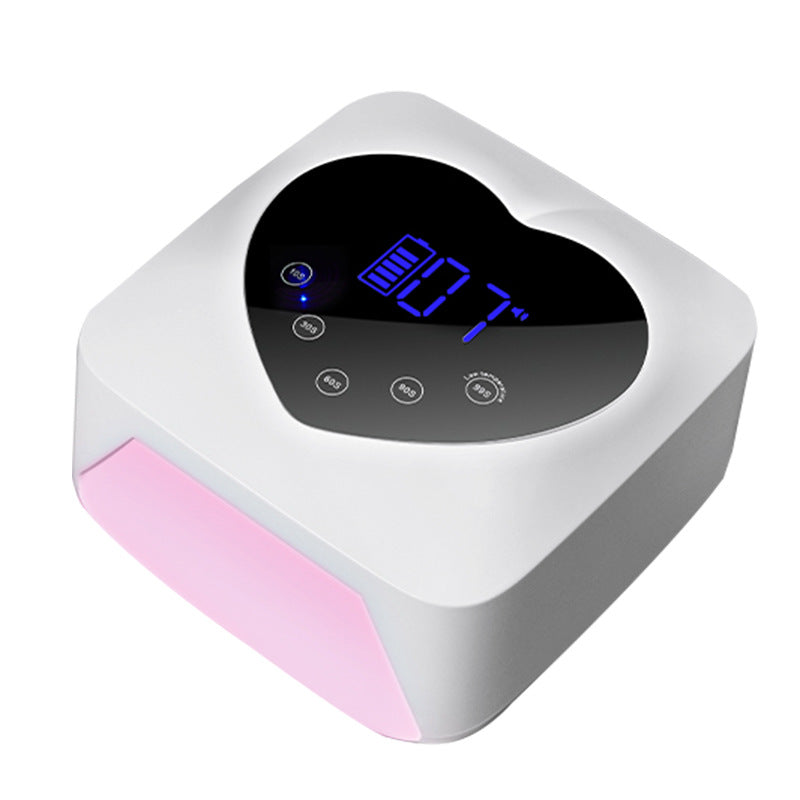 White and pink cordless nail lamp with a heart-shaped top panel featuring a digital display and multiple timer buttons.
