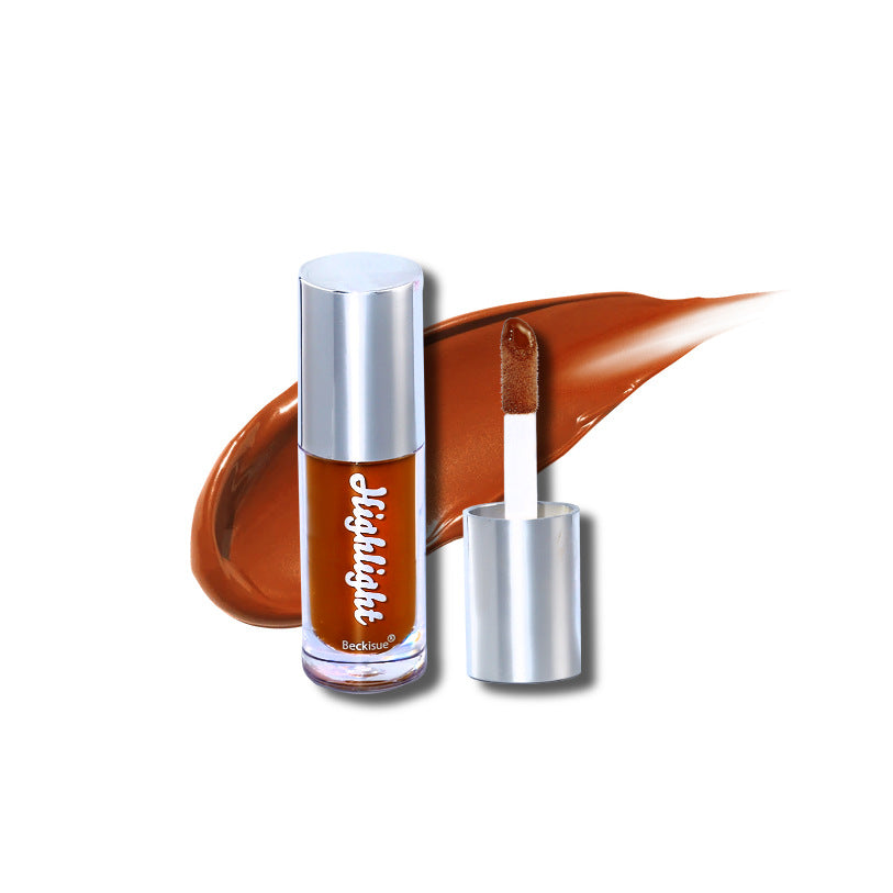 Deep brown luminous mirror lip gloss in a clear tube with silver cap, featuring a matching color swatch and applicator.