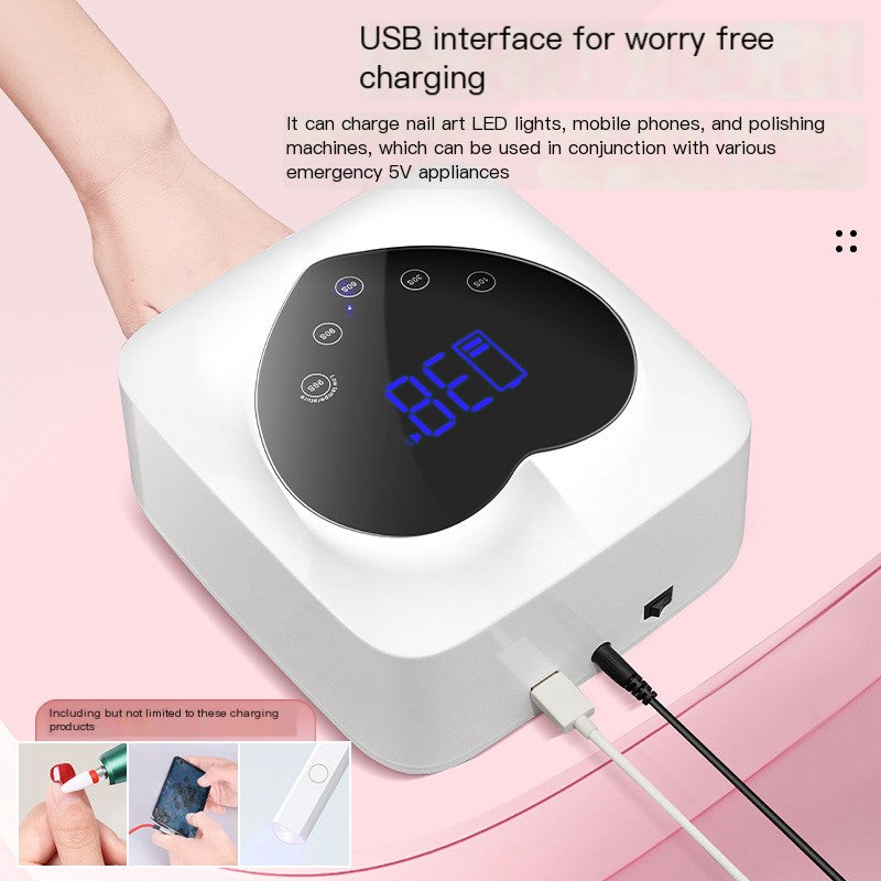 White, cordless X20 nail cure lamp with a black heart-shaped control panel, blue digital timer, and USB charging ports.