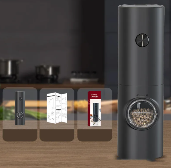 Matte black electric pepper grinder with clear viewing window, shown with product box and manual on a wooden surface.