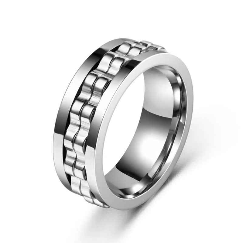 Silver-toned titanium steel fidget ring featuring a raised, central gear-link band with a smooth, polished finish.