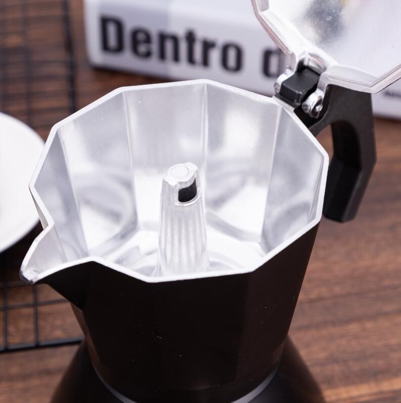 Creative Vault Marketplace black aluminum moka pot with lid open showing the interior funnel and octagonal design