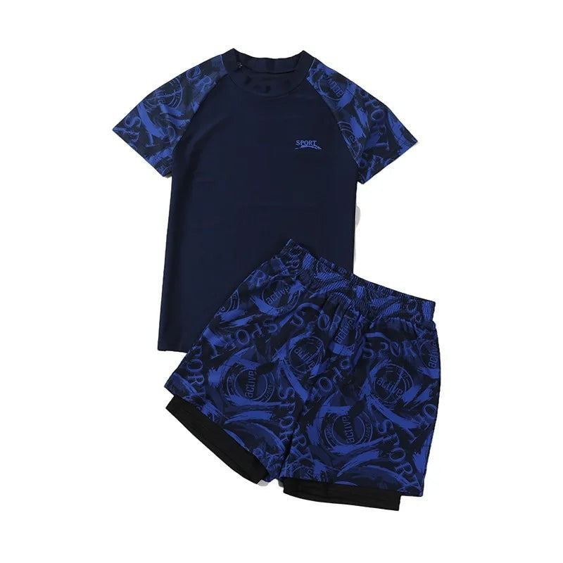 Creative Vault Marketplace boys two-piece navy blue short-sleeve swim set with patterned trunks and matching cap