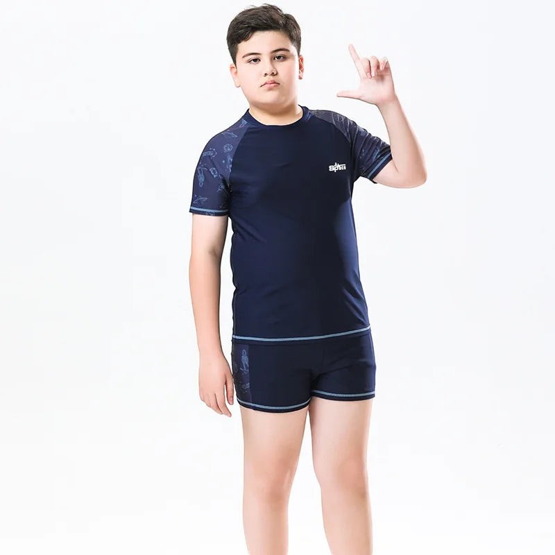Creative Vault Marketplace boys' plus size navy blue two-piece swim set with short sleeves and matching swim trunks