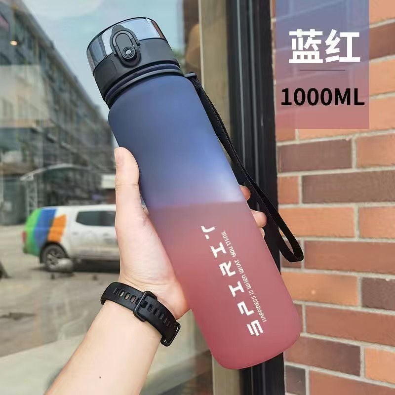 Creative Vault Marketplace 1000ml gradient blue and red sports water bottle with a secure lid and carrying strap