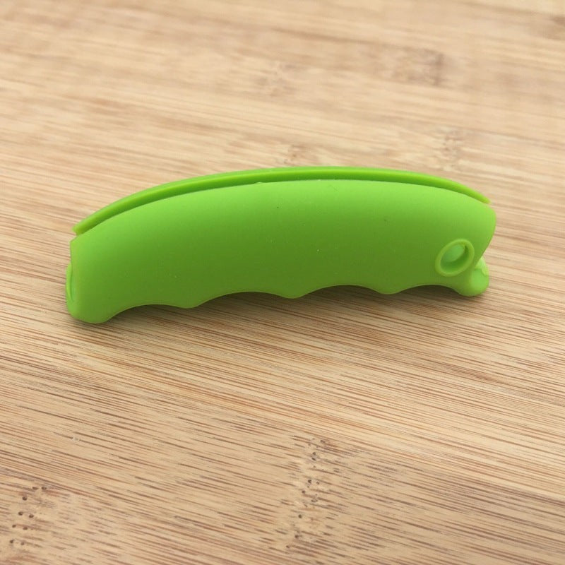 Creative Vault Marketplace green silicone grocery bag grip with ergonomic non-slip design on a wooden surface