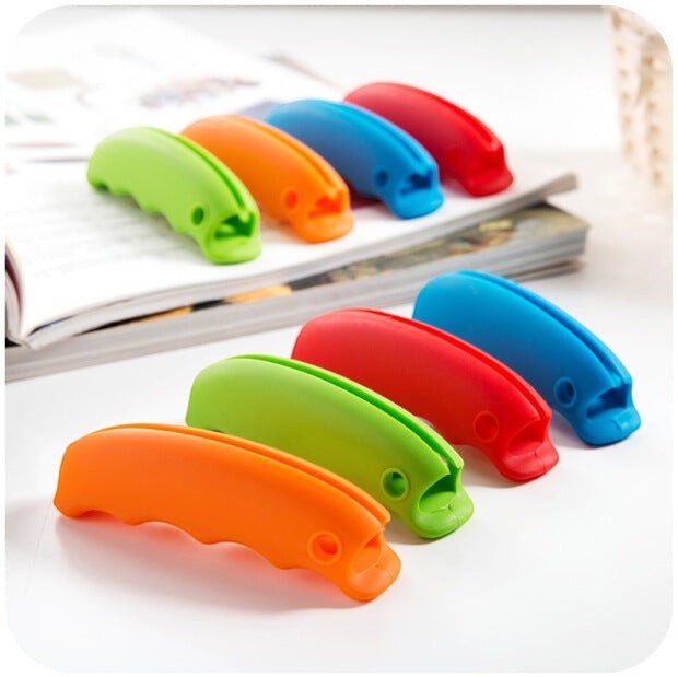 Creative Vault Marketplace ergonomic silicone grocery bag grips in vibrant orange, green, red, and blue colors.